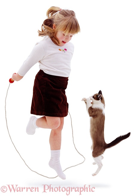 Marcia, 4 years old, skipping with a cat, white background