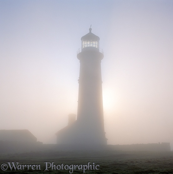 Old Lighthouse with misty atmosphere.  Lundy Island, England