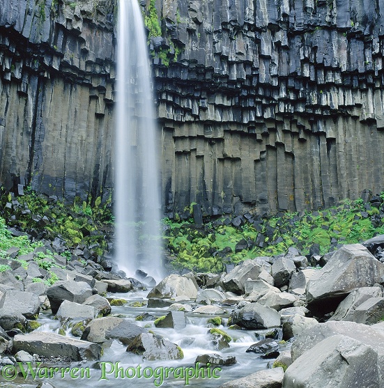 Columnar basalt and waterfall.  Iceland
