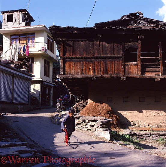 Boy with hoop in Old Manali.  India