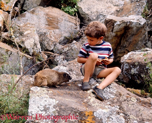 Mark sharing a biscuit with a rock hyrax.  Hell's Gate, Kenya