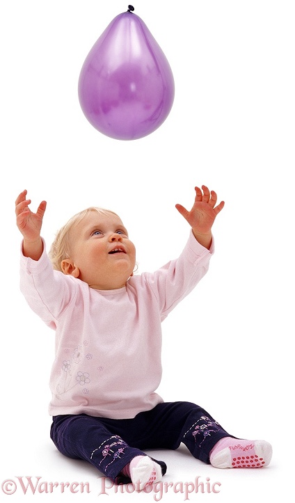 Siena, 13 months old, reaching up for a balloon, white background