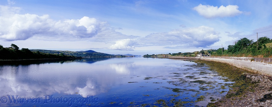 Cloud reflections on a still sea inlet.  Co. Cork, Ireland