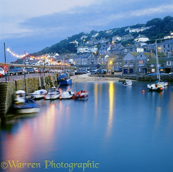Mousehole Harbour at dusk.  Cornwall, England