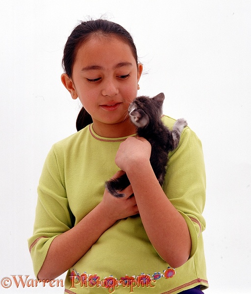 Melissa holding a tabby kitten, white background