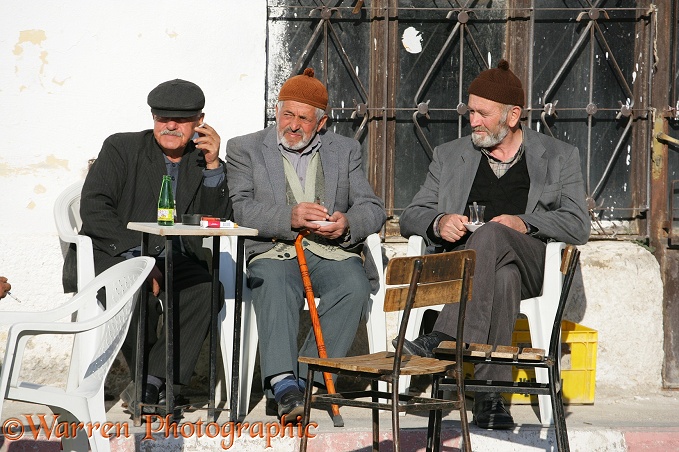 Turkish men drinking tea and smoking.  Kapadokia, Turkey