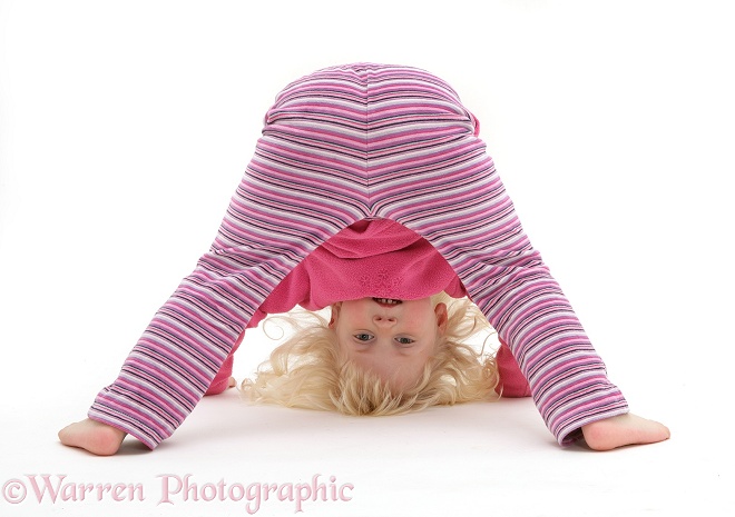 Siena looking between her legs, white background