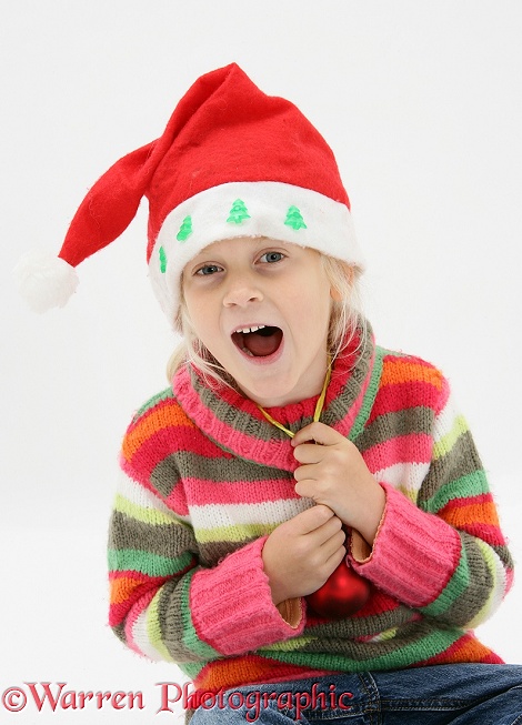 Siena laughing and wearing a Santa hat, white background