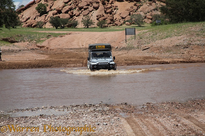 Crossing a swollen river during the rains, northern Namibia
