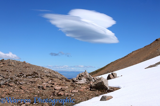 Rugged alpine landscape with lenticular cloud.  Los Alerces National Park, Argentina