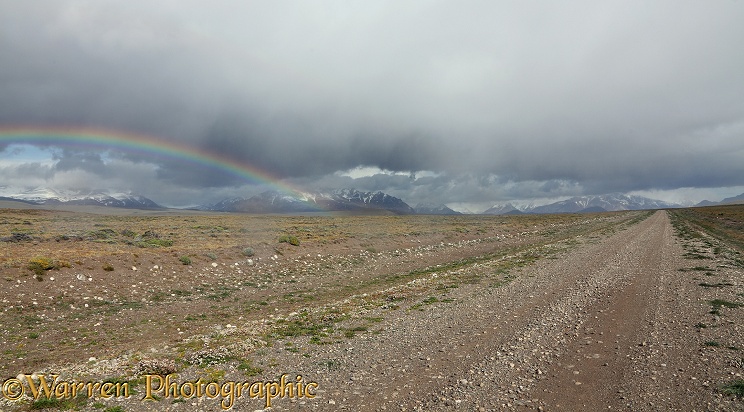 Remote dirt track and rainbow.  Patagonia
