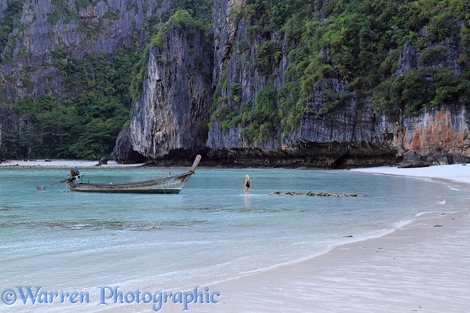 Boat and tropical sandy beach.  Koh Phi Phi, Thailand
