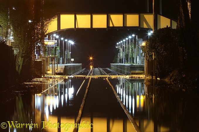 Flooded Datchet railway station, at night. Inundated by water from the River Thames in February 2014.  Berkshire, England