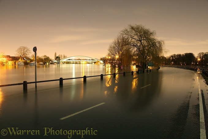 Flooded road in Weybridge along the River Thames at night. February 2014.  Surrey, England