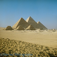 The Pyramids of Giza seen from the desert