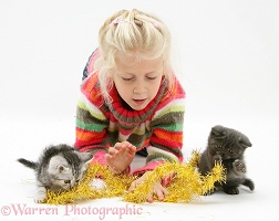 Girl with kittens and tinsel