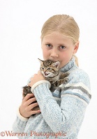 Girl cuddling a cute tabby kitten