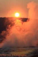 Steaming hot springs at sunset