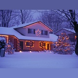 Snowy house with Christmas lights