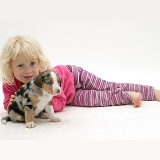 Little girl with merle Border Collie pup