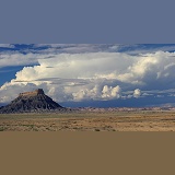 Rocky outcrop and cumulonimbus clouds