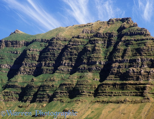 Basalt rocks, laid down by multiple volcanic eruptions.  Iceland