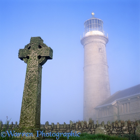 Misty Lundy old lighthouse and grave stone.  Lundy Island, England