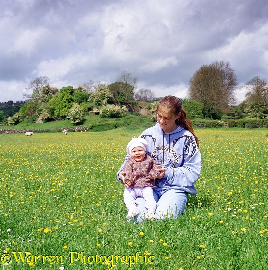 Jane and Siena, 5 months old, in buttercup field.  Derbyshire, England