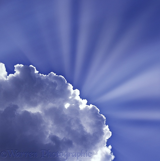 Blue sky and clouds with sunbeams