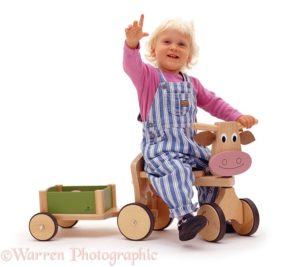 Siena with cow toy and trailer, white background