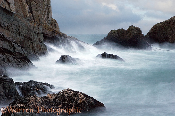 Waves on a rocky shore.  Lundy Island, England