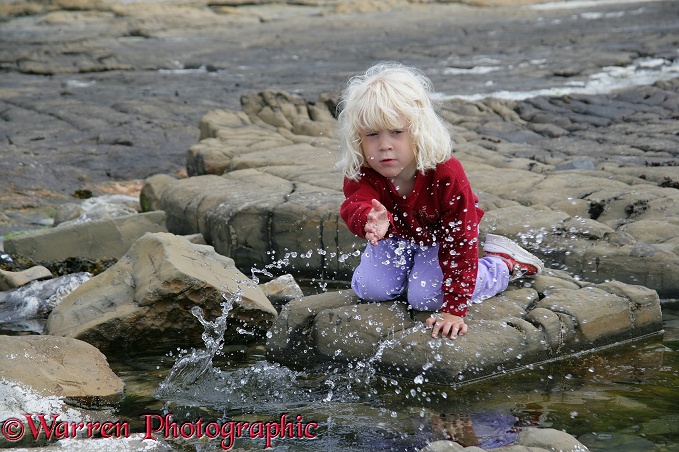 Siena splashing water at Kimmeridge.  Dorset, England