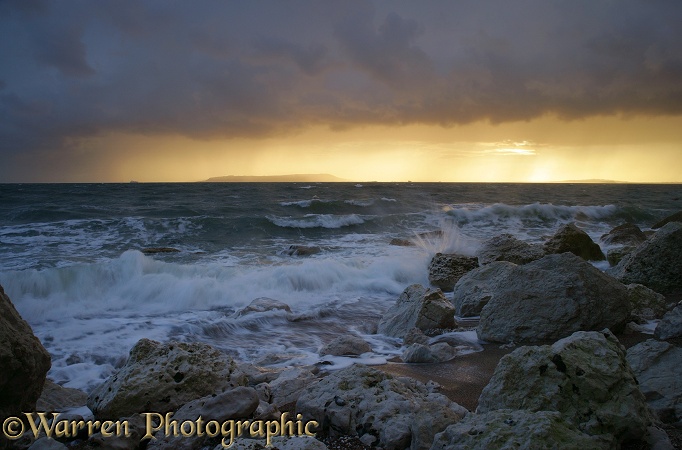 Rough sea at sunset.  Dorset, England