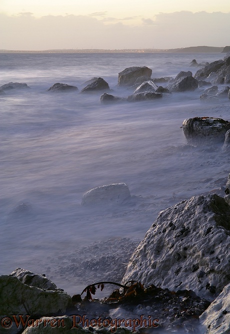 Rough sea at sunset.  Dorset, England