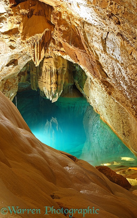 Stalactites and turquoise pool.  Grotte de Trabuc, France