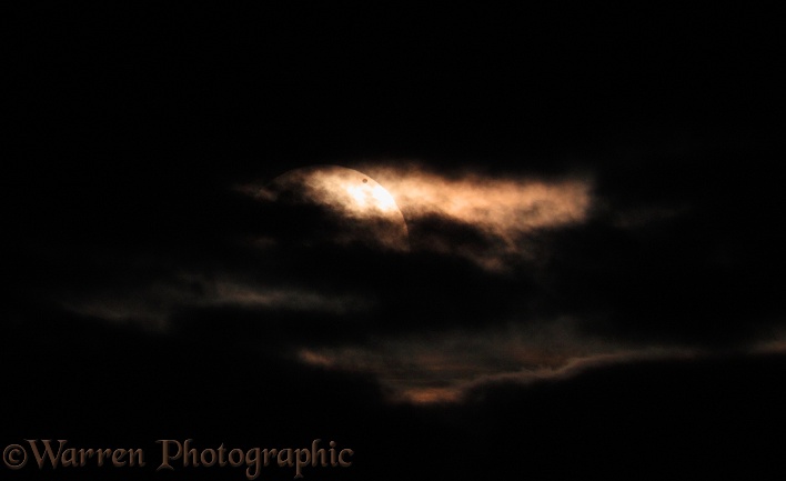 Transit of Venus across the sun, partially obscured by clouds. 6th June 2012.  Surrey, England