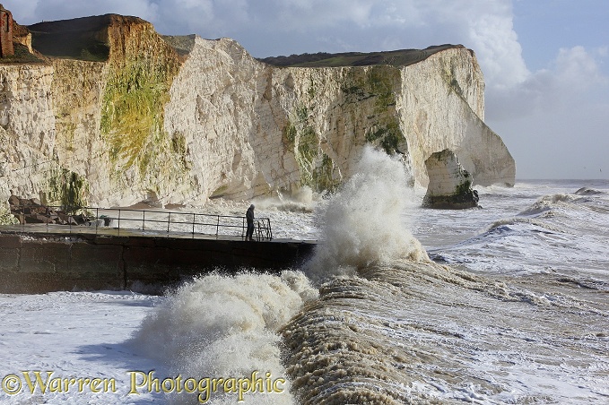 Waves breaking against sea wall and cliffs. Seaford, February 2014.  Sussex, England