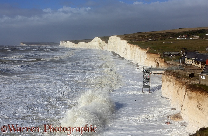Chalk cliffs being pounded by huge waves whipped up during a winter storm at Birling Gap.  Sussex, England
