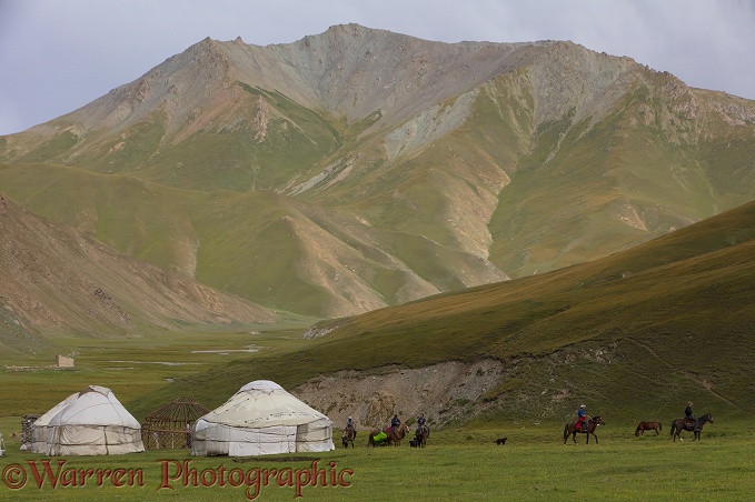 Tash Rabat yurts and horse riders.  Kyrgyzstan