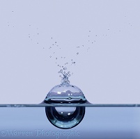 Water drop forming a bubble