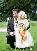 Best man and little girl bridesmaid