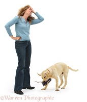 Woman disparing at disobedient dog