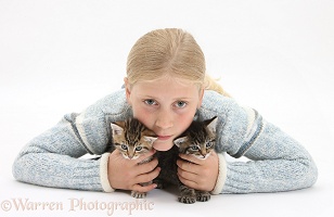 Girl cuddling a cute tabby kittens