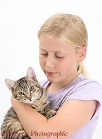 Girl cuddling a tabby kitten