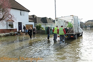 Handing our sand bags in flooded Weybridge 2014