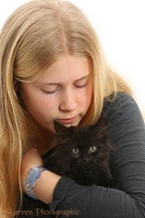 Girl with black fluffy kitten