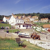 Runswick Bay village, with tractor pulling boat down to the sea