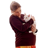 Pregnant lady holding a cat