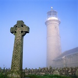 Misty Lundy old lighthouse and grave stone