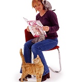 Woman reading Your Cat magazine